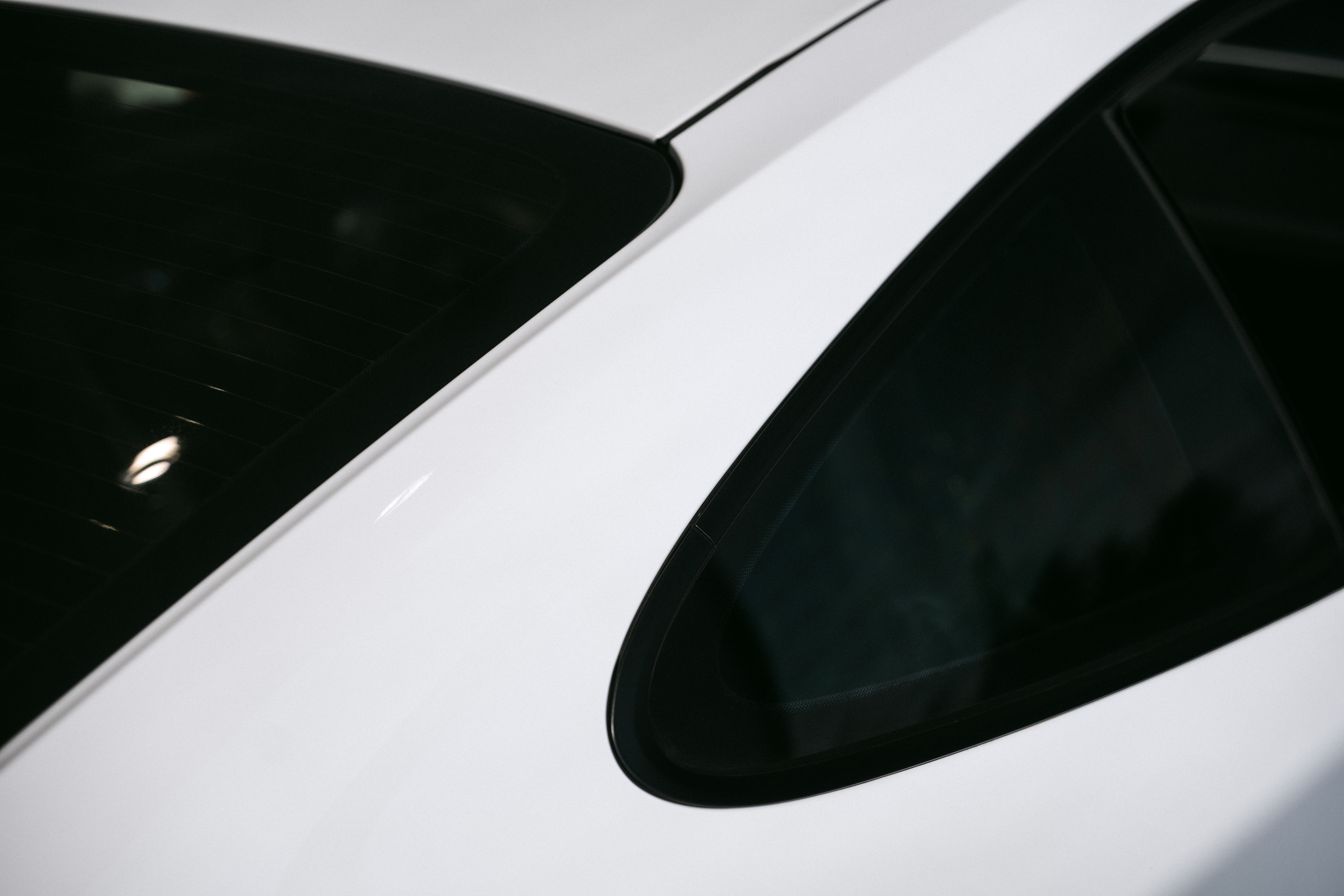 Technician installing window tint film